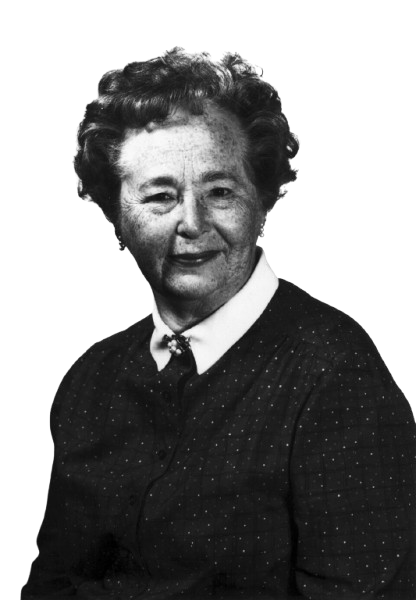 Freundlich aussehende lächelnde Frau mit groblockigen Haar gekleidet mit Bluse & Pullover. Die Frau heißt Gertrude Belle Elion.